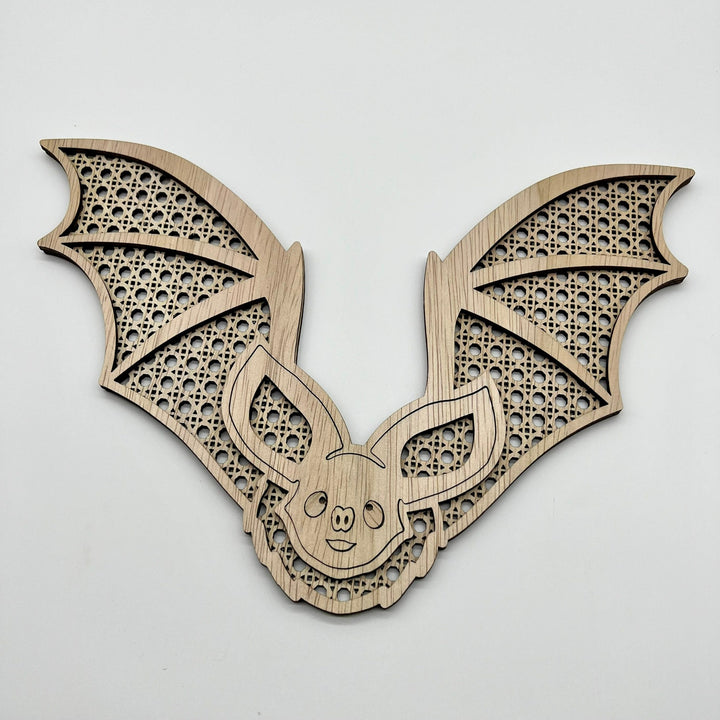 Bat rattan layered wall art.